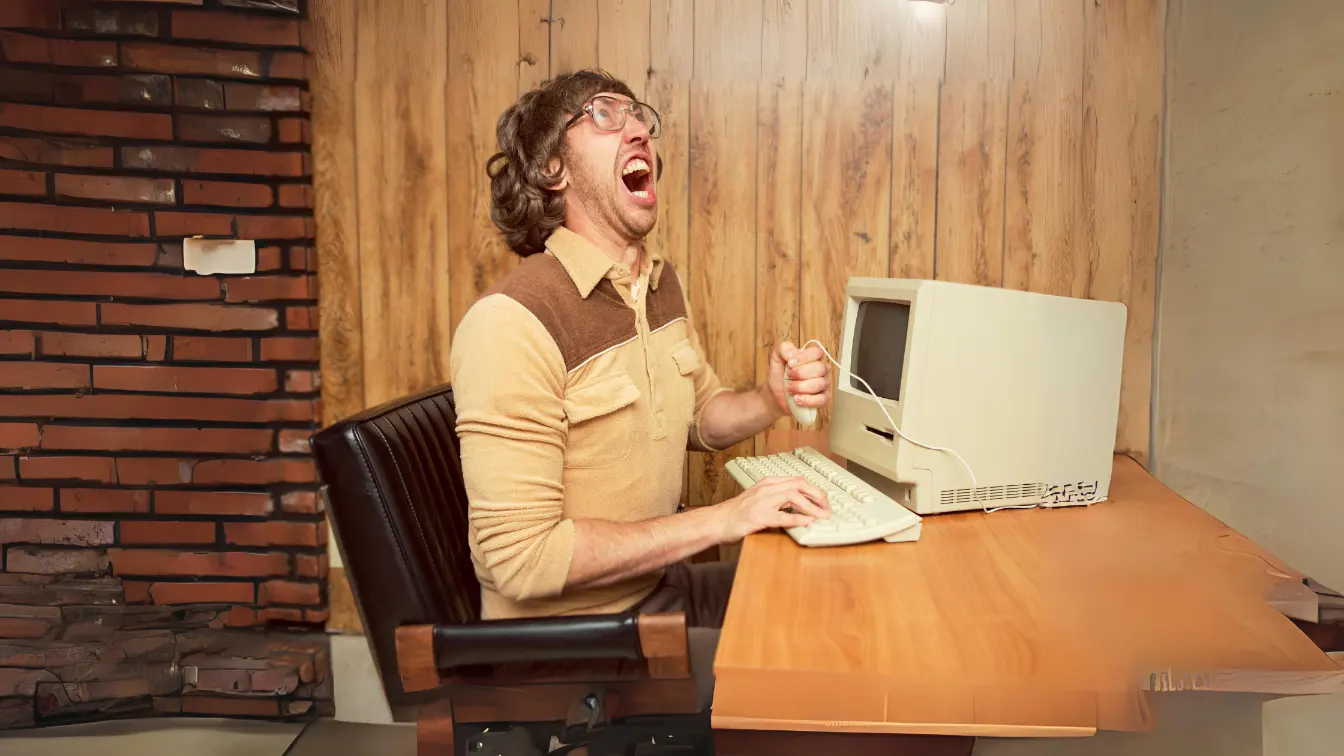 frustrated-man-on-analog-computer.