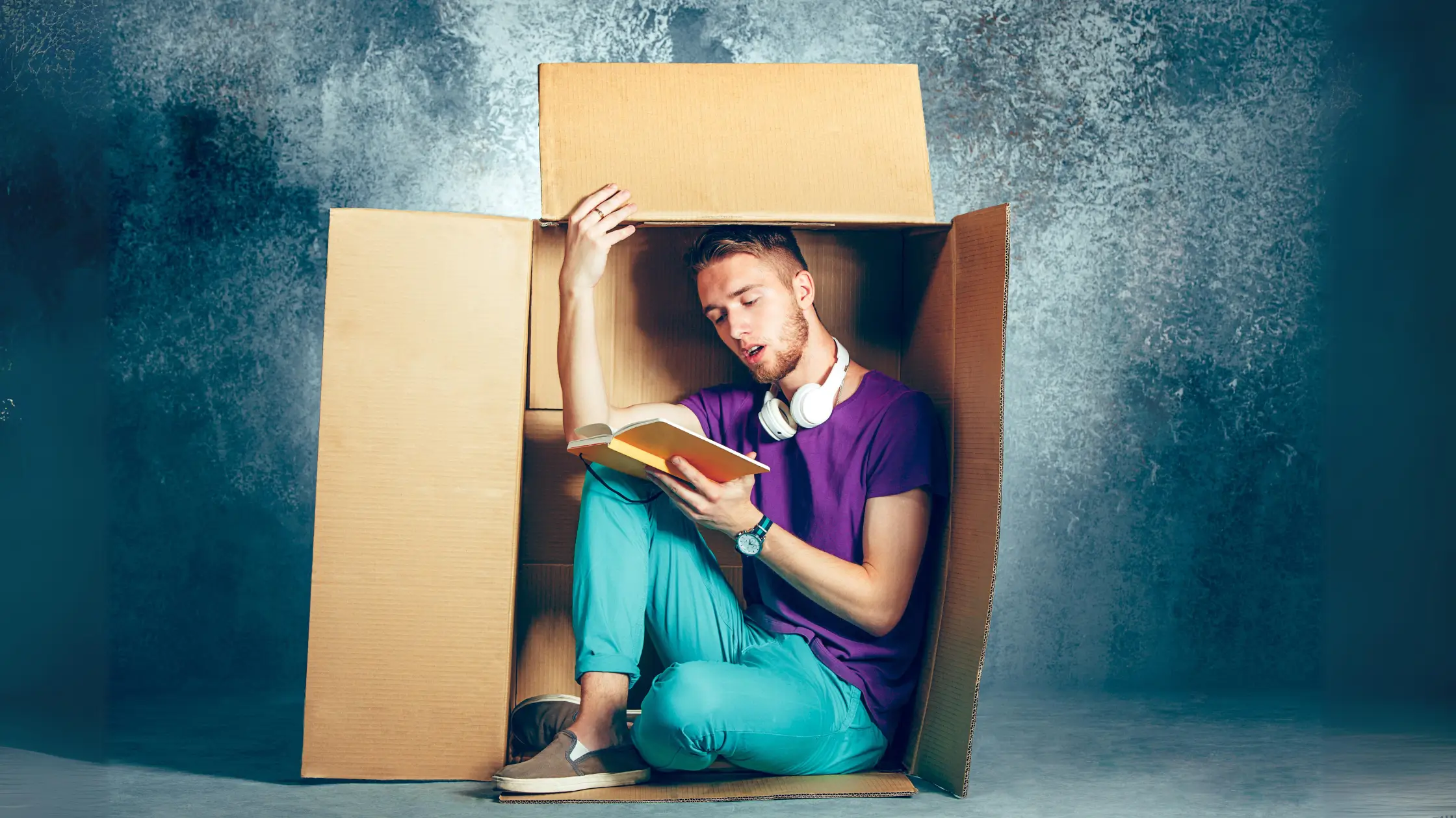 man in cardboard box